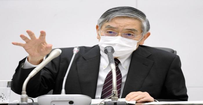 FILE PHOTO: Bank of Japan Governor Haruhiko Kuroda wearing a protective face mask attends a