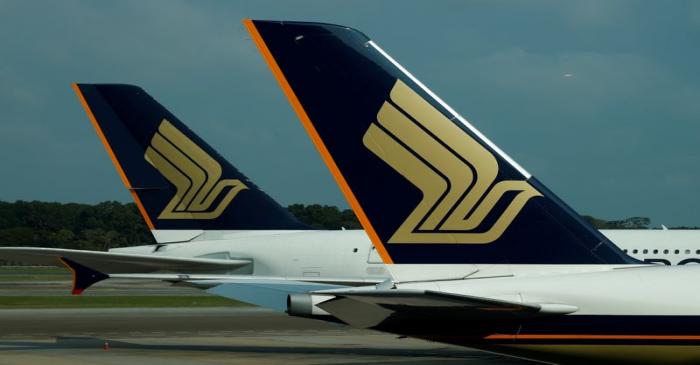 FILE PHOTO: Singapore Airlines planes sit on the tarmac at Singapore's Changi Airport