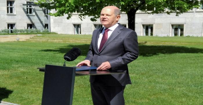 FILE PHOTO: German Finance Minister Olaf Scholz gives a statement in the yard of the finance