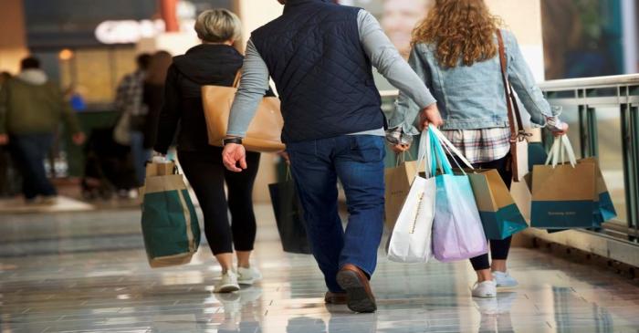 FILE PHOTO: Shoppers carry bags of purchased merchandise at the King of Prussia Mall, United