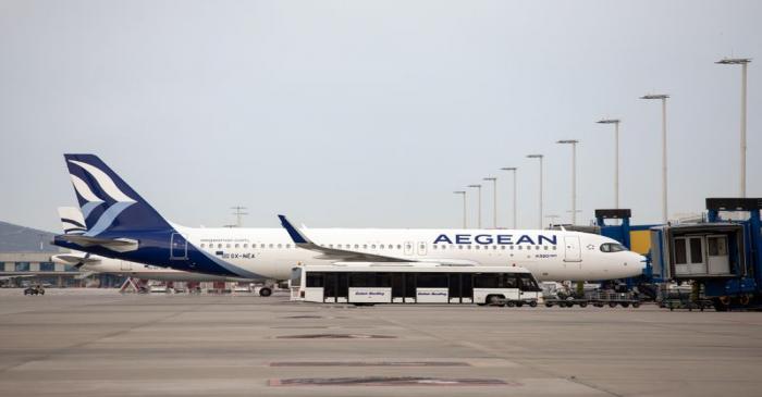 FILE PHOTO: An Aegean Airlines Airbus A320neo is docked at a plane jetway of the Eleftherios