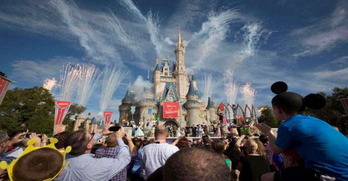 FILE PHOTO: Fireworks go off around Cinderella's castle during the grand opening ceremony for