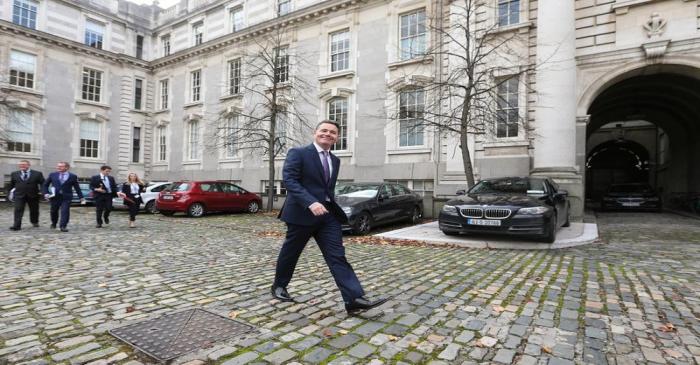 Irish Finance Minister Paschal Donohoe walks outside Government Buildings in Dublin