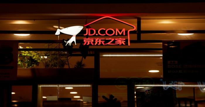 FILE PHOTO: A sign of China's e-commerce company JD.com is seen at its shop at a mall in