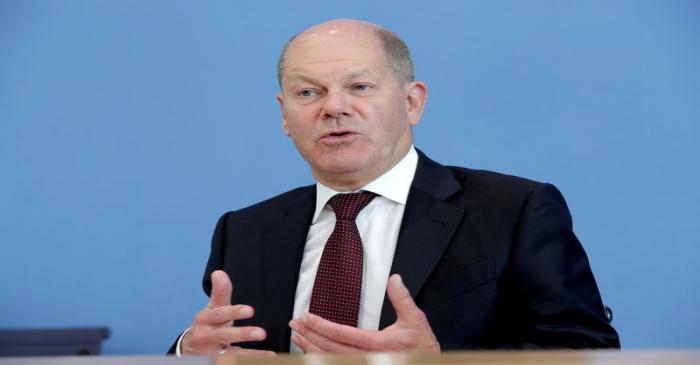 FILE PHOTO: German Finance Minister Olaf Scholz attends a news conference in Berlin