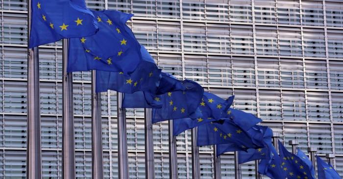 FILE PHOTO: European Union flags fly outside the European Commission headquarters in Brussels