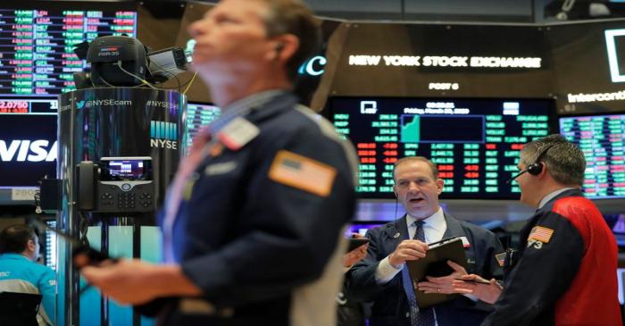 Traders work on the floor of the NYSE in New York