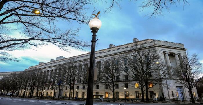 FILE PHOTO: The U.S. Department of Justice building is bathed in morning light at sunrise in