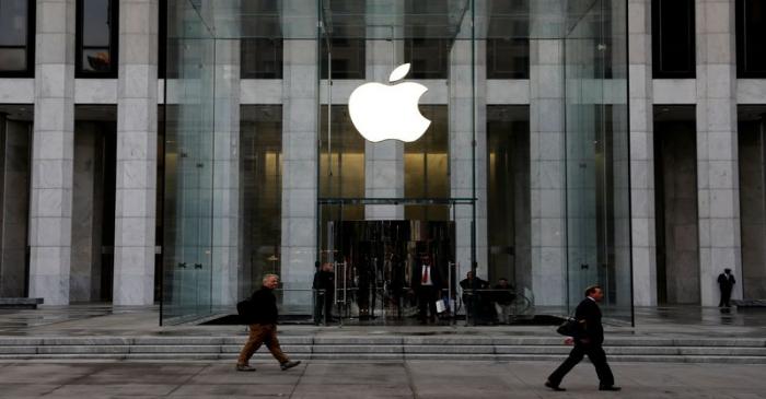 The Apple Inc. logo is seen hanging at the entrance to the Apple store on 5th Avenue in New