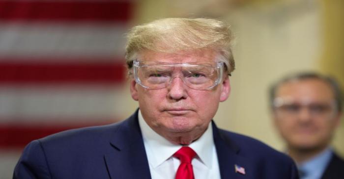 FILE PHOTO: U.S. President Donald Trump tours face mask production facility in Phoenix, Arizona