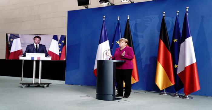 German Chancellor Angela Merkel holds a joint video news conference with French President