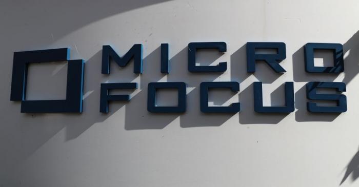 FILE PHOTO: A sign stands outside the offices of Micro Focus in Newbury