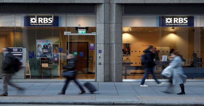FILE PHOTO: People walk past a branch of the Royal Bank of Scotland in London