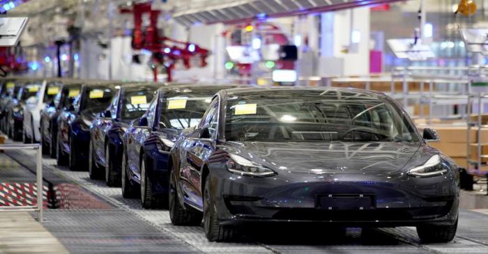 FILE PHOTO: Tesla China-made Model 3 vehicles are seen during a delivery event at its factory