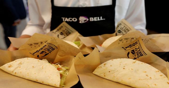 FILE PHOTO: Server holds food during opening ceremony of Taco Bell restaurant in Bangkok