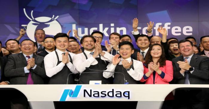 FILE PHOTO: Jenny Qian Zhiya CEO of Luckin Coffee and employees ring the opening bell to