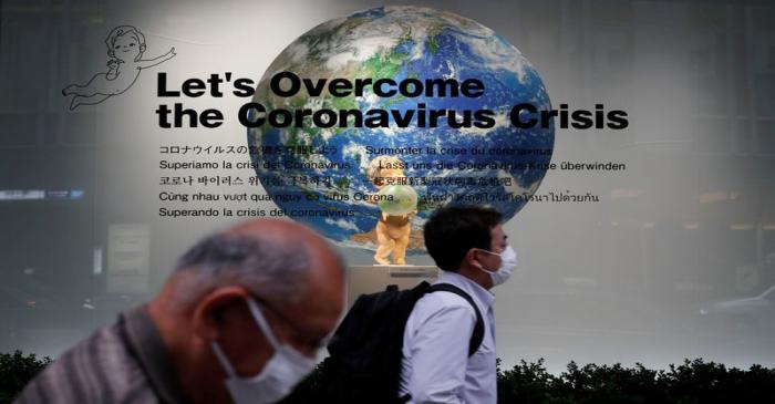 Pedestrians wearing protective face masks, following the coronavirus disease (COVID-19)