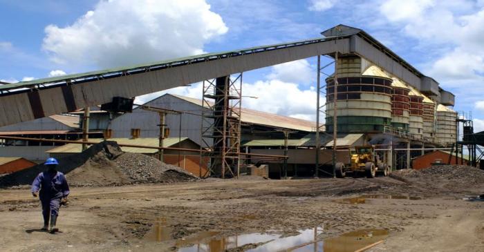 FILE PHOTO: Worker walks near the Congolese state mining company Gecamines' copper concentrator