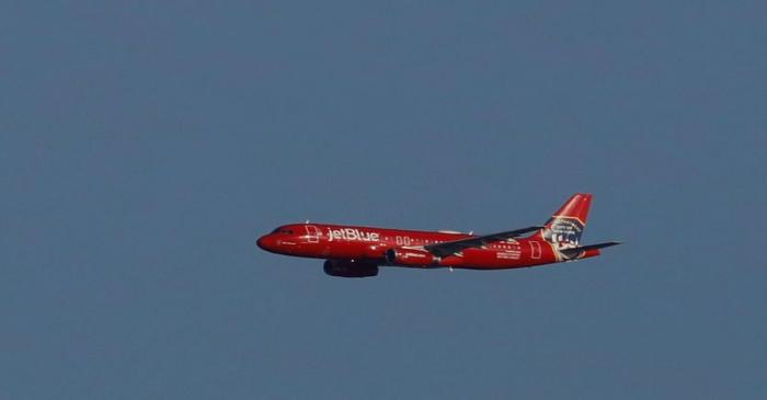 FILE PHOTO: FILE PHOTO: A JetBlue A320 aircraft conducts a flyover salute of New York City to