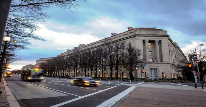 FILE PHOTO: The U.S. Department of Justice building is bathed in morning light at sunrise in