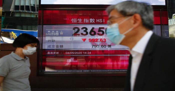 FILE PHOTO: A panel displays the Hang Seng Index during afternoon trading, in Hong Kong