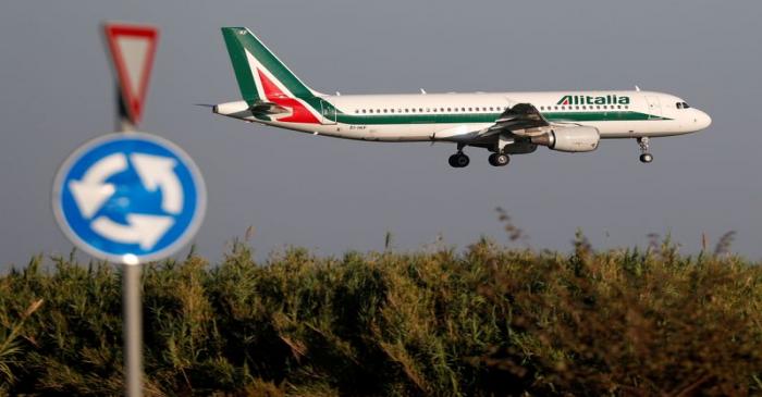 FILE PHOTO: An Alitalia Airbus A320 airplane approaches to land at Fiumicino airport in Rome,