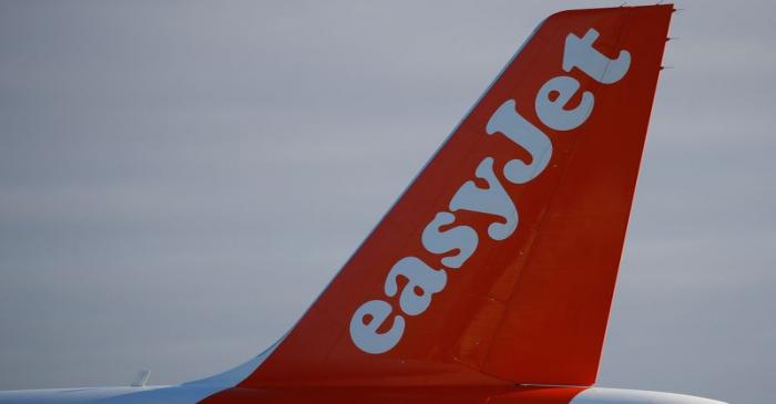 The company logo is seen on the tail of an Easyjet plane at Manchester Airport in Manchester