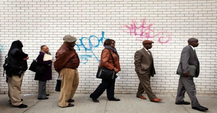 Jobseekers stand in line to attend the Dr. Martin Luther King Jr. career fair held by the New