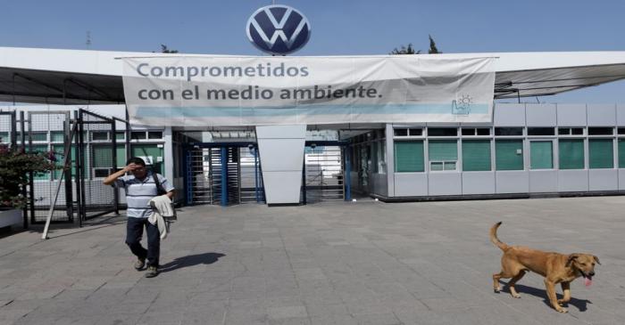 FILE PHOTO: An employee leaves the Volkswagen (VW) plant as the company will temporarily close