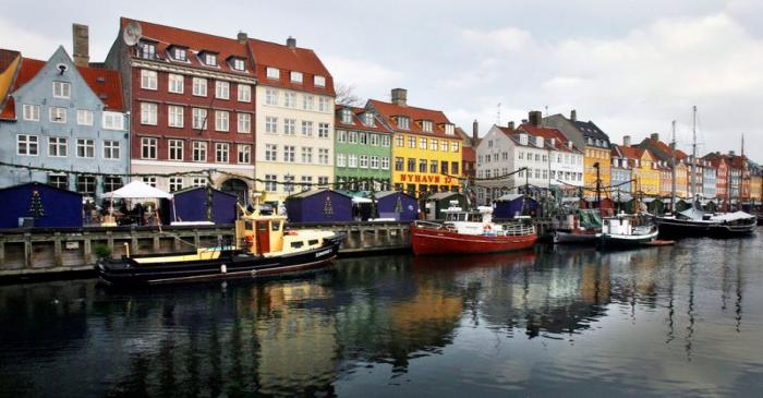 Boats are seen anchored at the 17th century Nyhavn district, home to many shops and restaurants