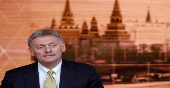 FILE PHOTO: Kremlin spokesman Dmitry Peskov listens during Russian President Vladimir Putin's