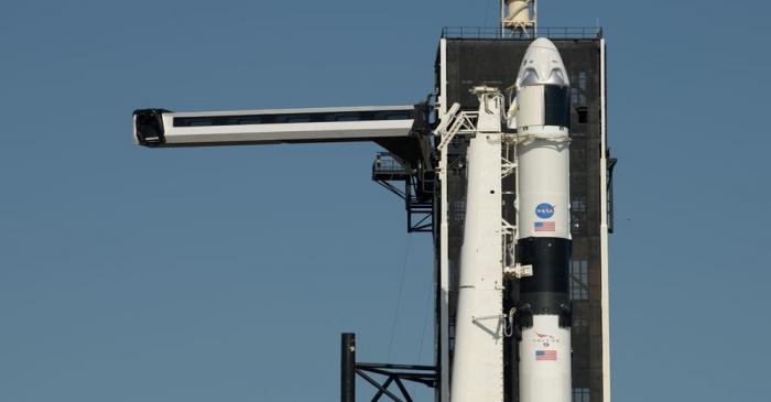 FILE PHOTO: The crew access arm is swung into position to a SpaceX Falcon 9 rocket with the