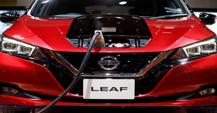 FILE PHOTO: A charging cable is attached to a Nissan Leaf electric car at the Tokyo Motor Show