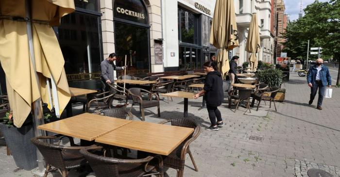 Staff of Grand Bar Cafe Restaurant prepare for reopening of the restaurant in Berlin