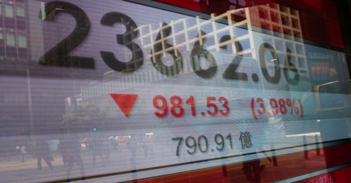 FILE PHOTO: A panel displays the Hang Seng Index during afternoon trading, in Hong Kong