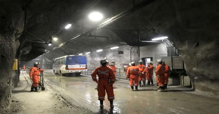 FILE PHOTO: Miners wait for transport inside the Codelco El Teniente copper mine, the world's