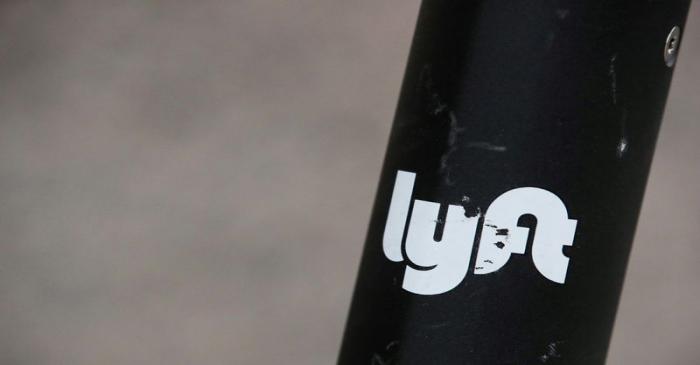 The Lyft  logo is seen on a parked Lyft Scooter in Washington