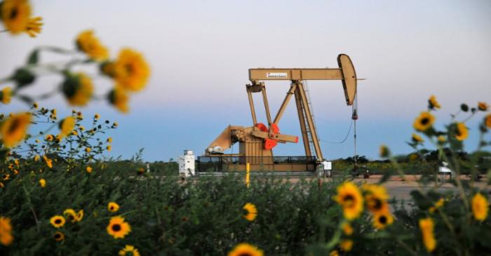FILE PHOTO: A pump jack operates at a well site leased by Devon Energy Production Company near