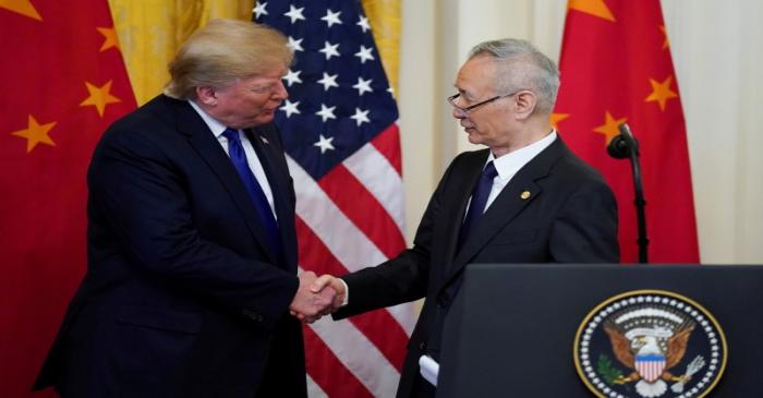 FILE PHOTO: U.S. President Donald Trump shakes hands with Chinese Vice Premier Liu He during