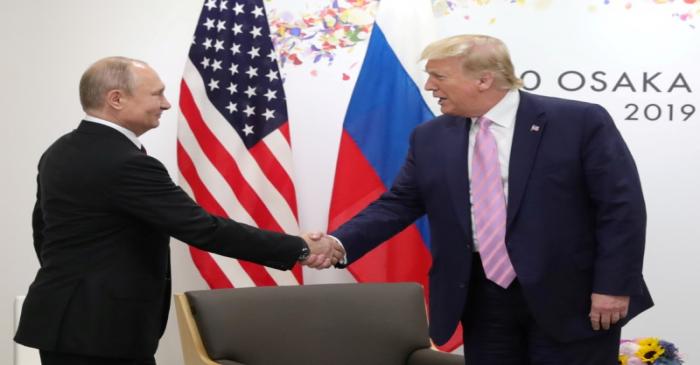 FILE PHOTO: Russia's President Vladimir Putin and U.S. President Donald Trump attend a meeting