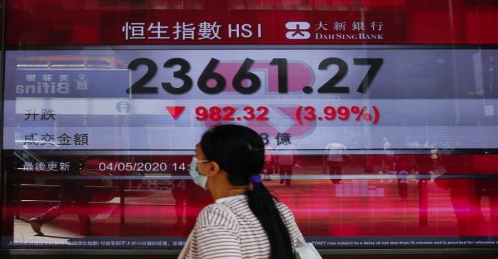 A panel displays the Hang Seng Index during afternoon trading, in Hong Kong