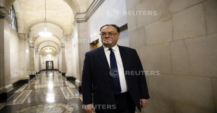 Bank of England Governor Andrew Bailey poses for a photograph on the first day of his new role