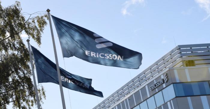 FILE PHOTO:  Flags with Ericsson logo are pictured outside company's head office in Stockholm