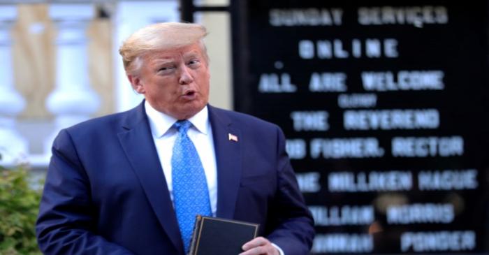 U.S. President Trump holds a Bible during photo opp in front of St John's Church in Washington