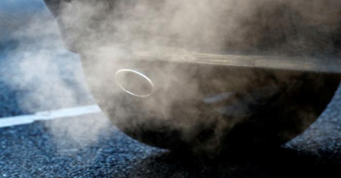 FILE PHOTO: An exhaust pipe of a car is pictured on a street in a Berlin