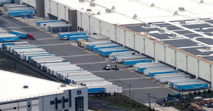 FILE PHOTO: Amazon.com trucks are seen at an Amazon warehouse in Staten Island in New York City