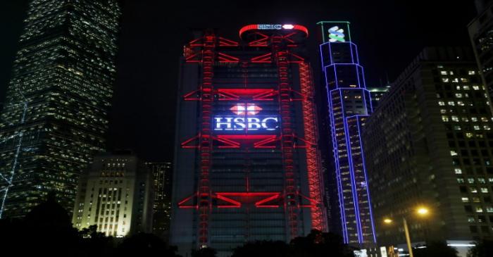 FILE PHOTO: A lighting show displays company logo of HSBC on the bank's headquarters in Hong