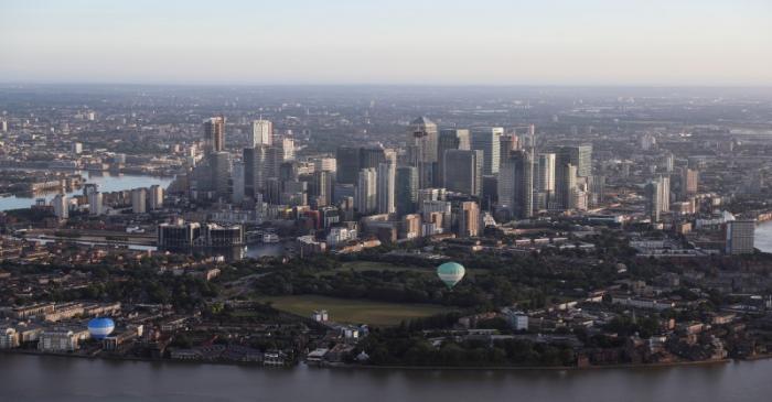 FILE PHOTO: Hot air balloons fly over the Canary Wharf district in London