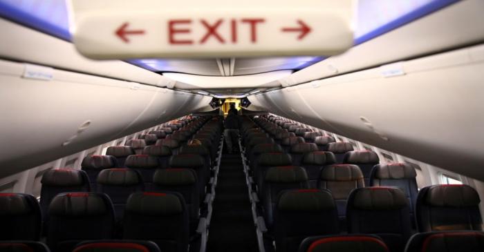 FILE PHOTO: Rows of empty seats of an American Airline flight are seen, as coronavirus disease