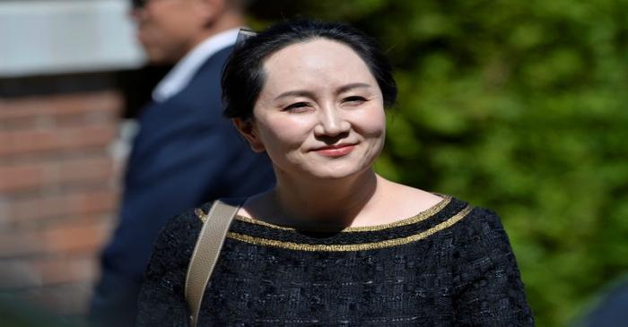 FILE PHOTO: Huawei Technologies Chief Financial Officer Meng Wanzhou leaves her home to attend